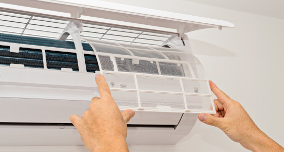 Screen being installed on a HVAC system